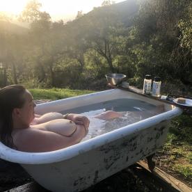 One of my Playmates enjoying the outside claw foot tub. Sheâ€™s a fun one cause sometimes you Need some big tits. Just look at those !!! - Rate My Wand